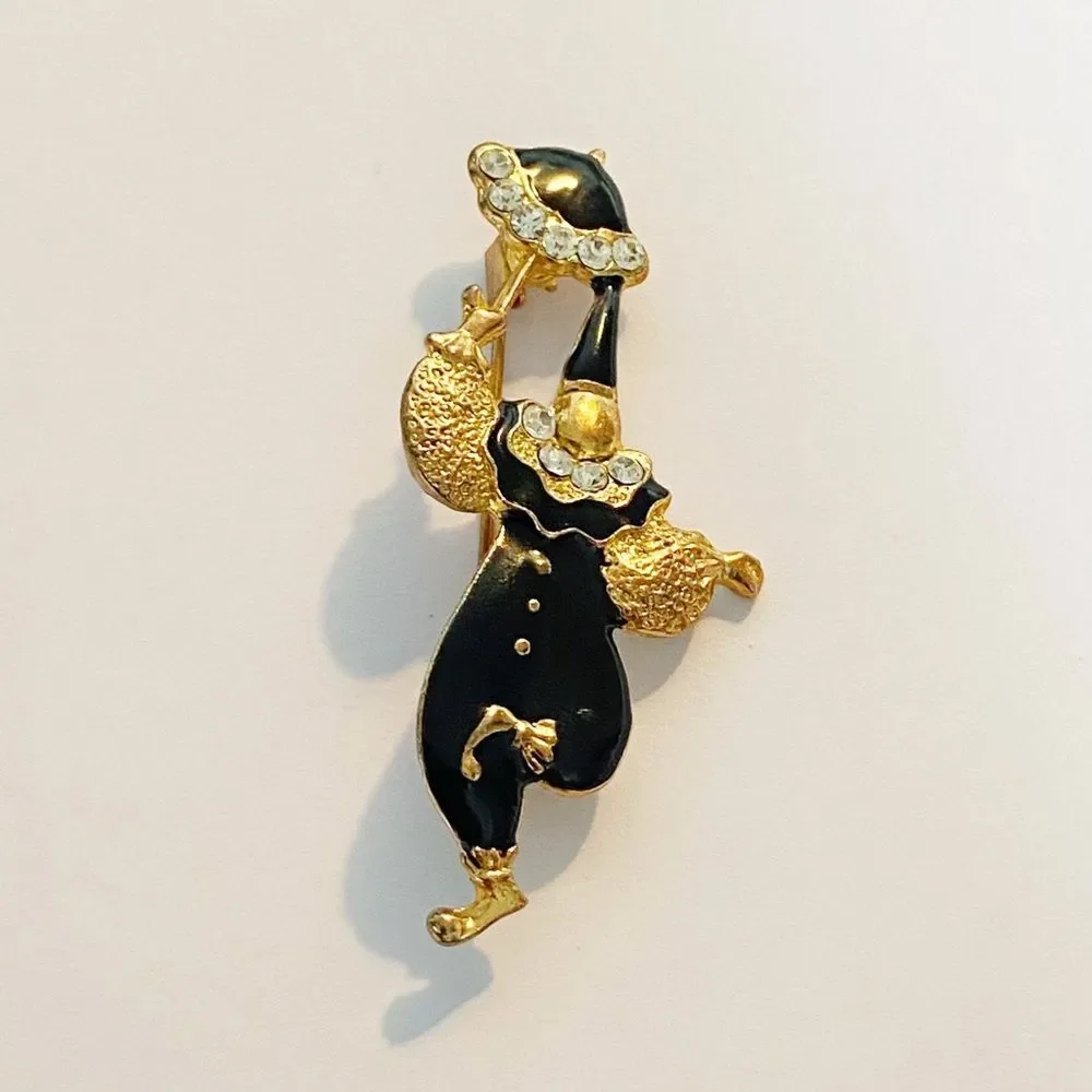 Vintage gold enamel rhinestone clown brooch